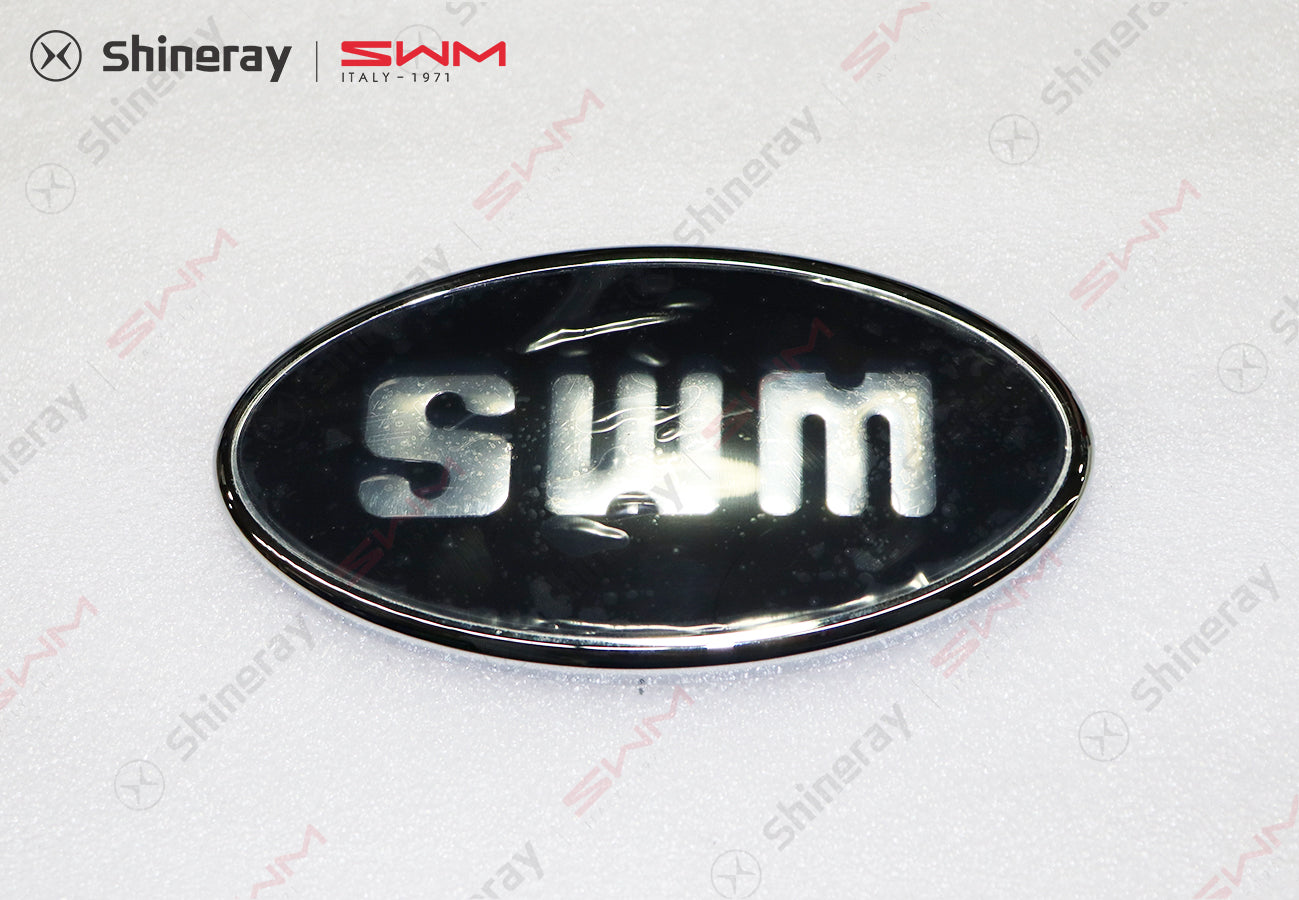 3921110-E0010-A000000>SWM front emblem